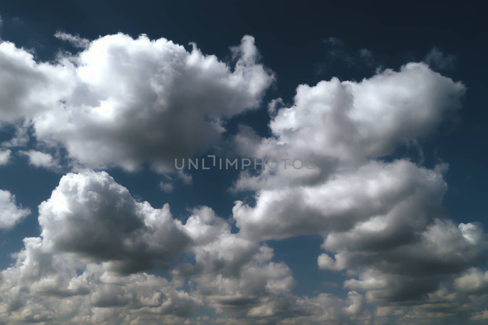 Heavenly abyss, blue sky and cumulus clouds