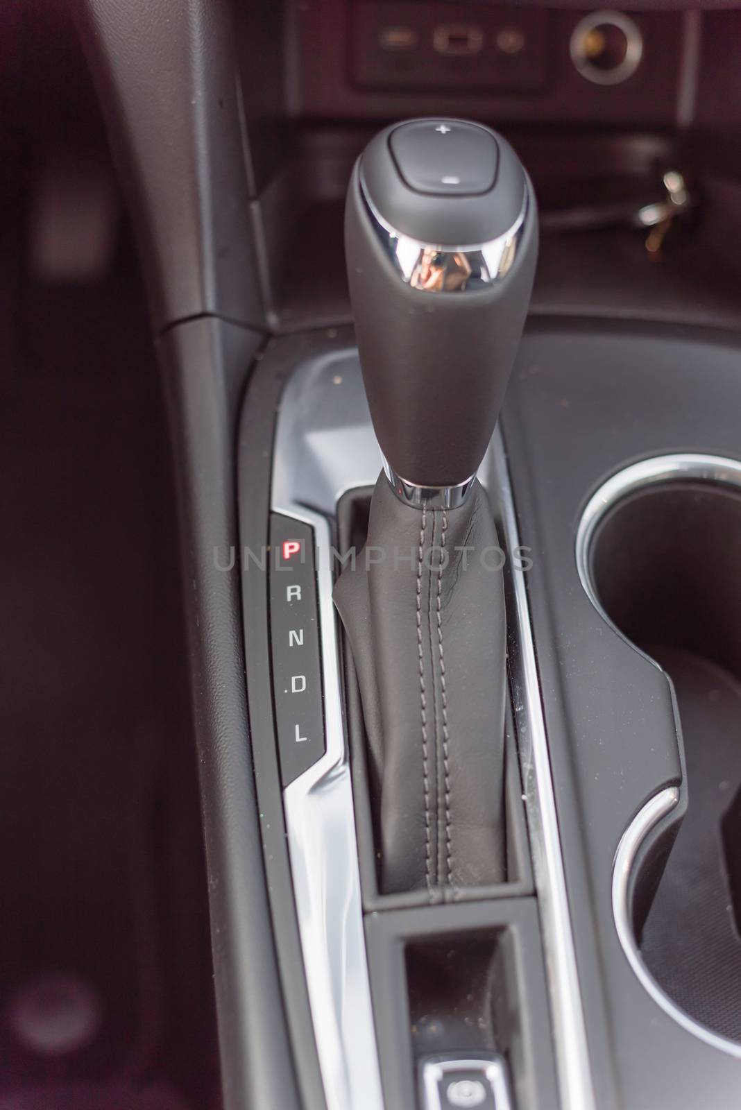 Close-up top view automatic gear stick of a modern car. Automatic transmission in Parking, parked P mode.