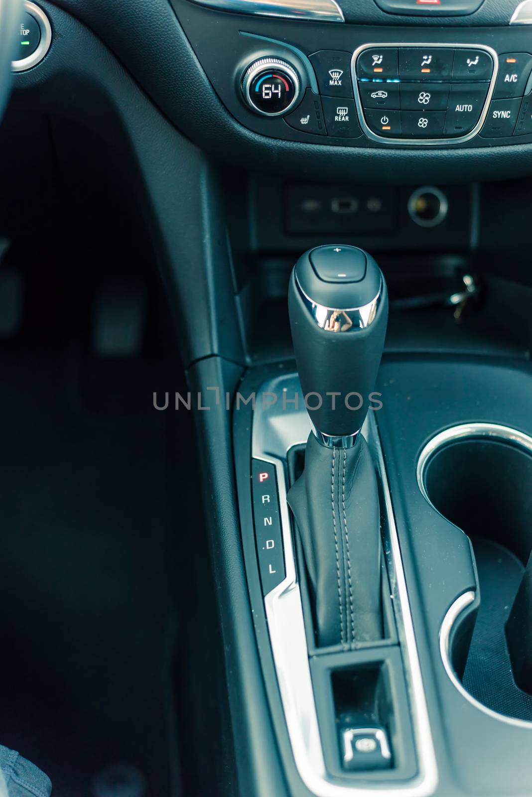 Vintage tone close-up top view automatic gear stick of a modern car. Automatic transmission in Parking, parked P mode.
