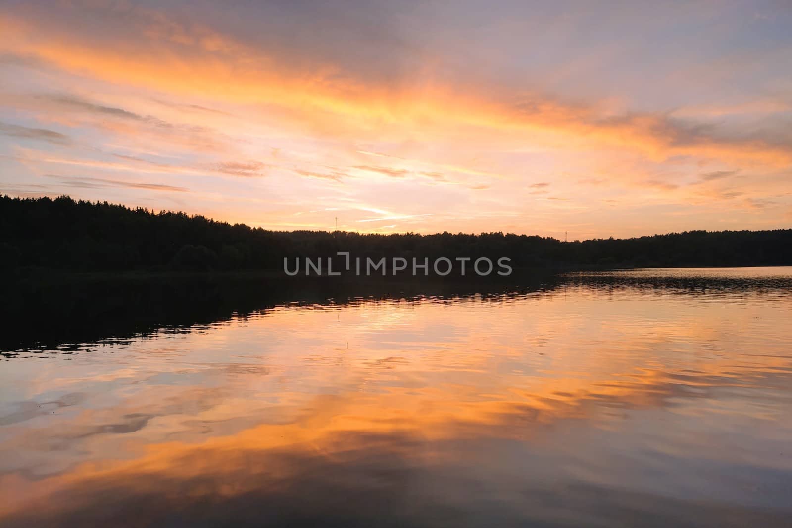 Beautiful sunset on the lake or river. Nature background