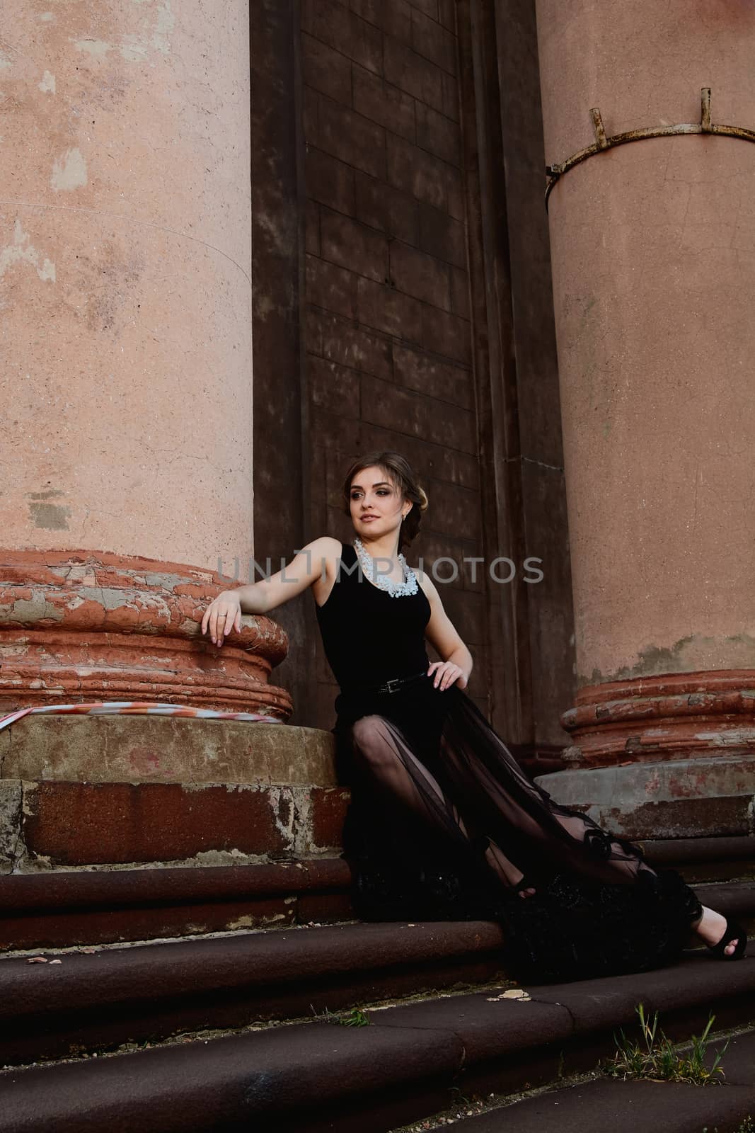 Young attractive woman is wearing the sexy transparent black dress. Young woman modern portrait. by nixrenas