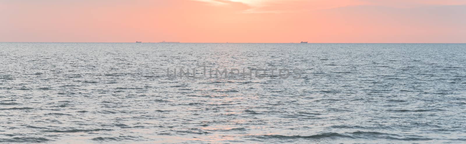 Panoramic view peaceful scene of sunset on the beach of Melaka, Malaysia by trongnguyen