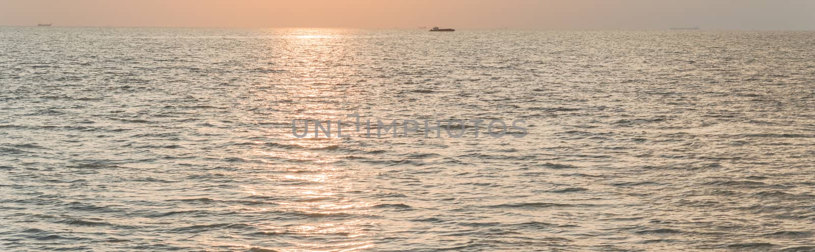 Panoramic view peaceful scene of sunset on the beach of Melaka, Malaysia by trongnguyen