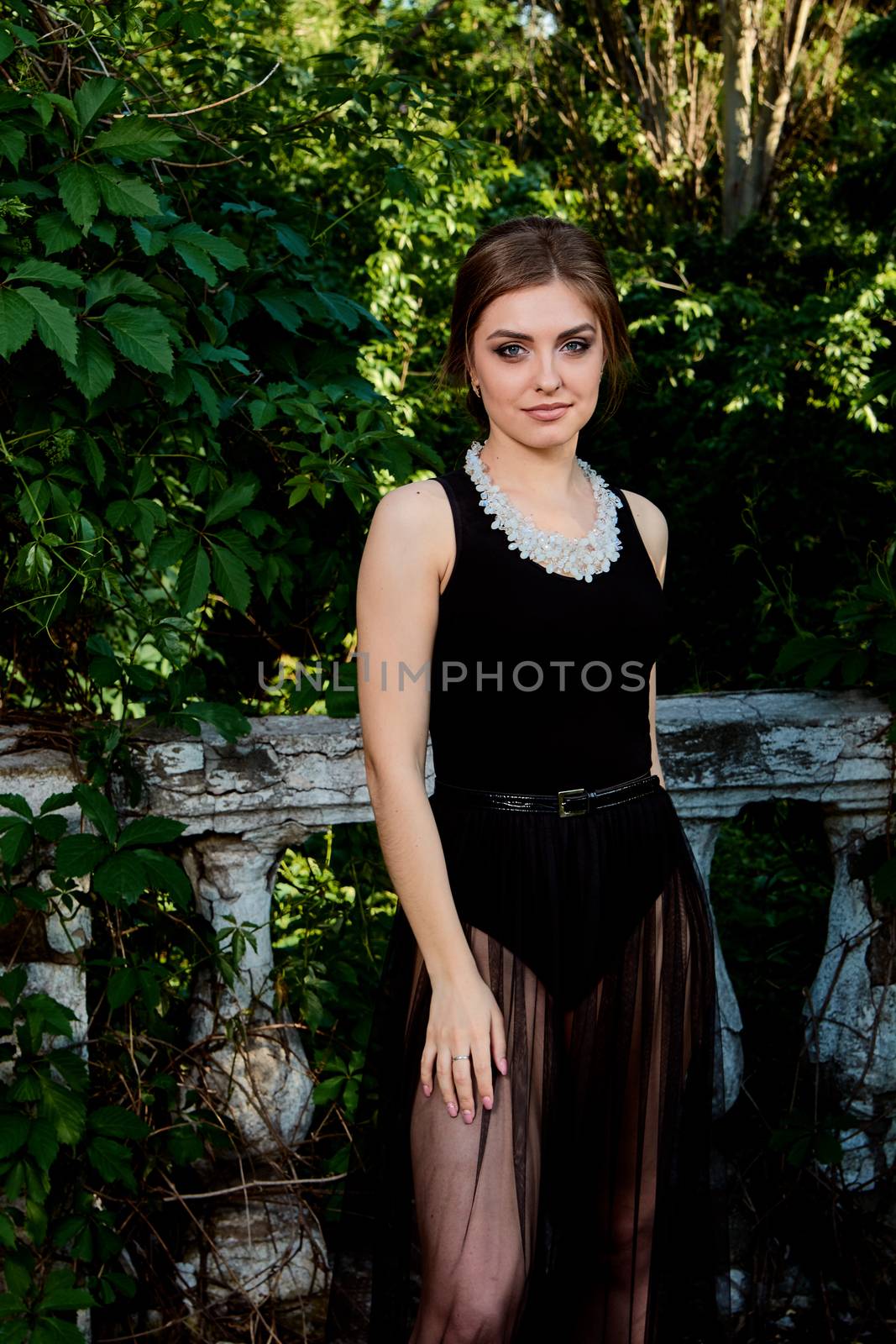 Young attractive woman in the sexy transparent black dress. Young woman portrait. by nixrenas