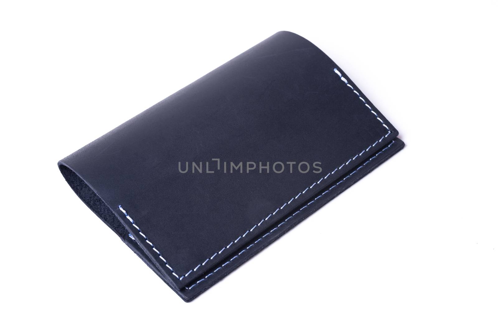 Blue handmade leather passport cover isolated on white background. Cover is closed. Stock photo of luxury businessman accessories.