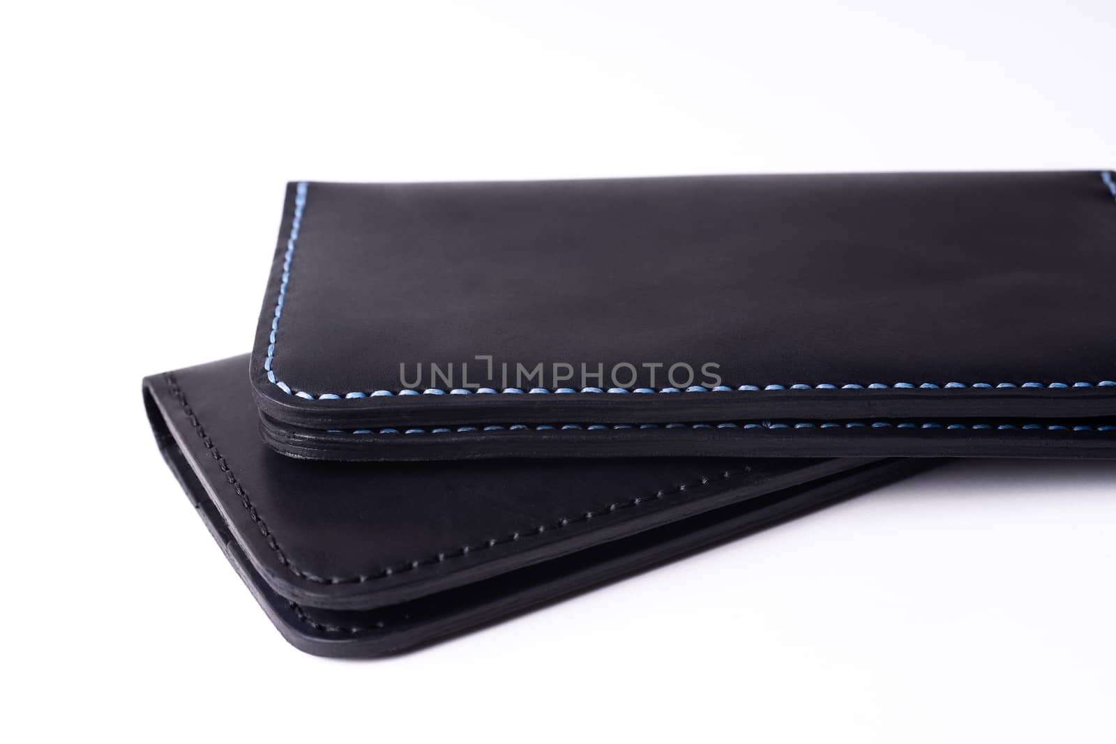 Two handmade leather black purse isolated on white background. Stock photo of luxury accessories.