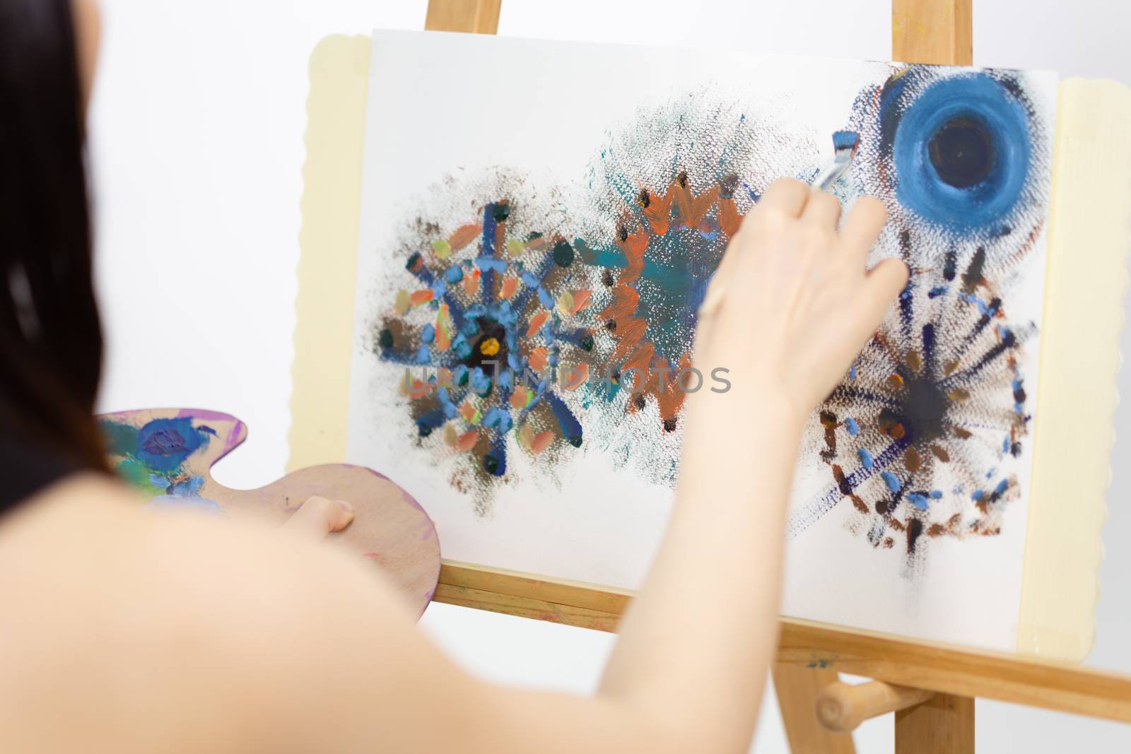 Close up of artist painting on an easel, POV shot