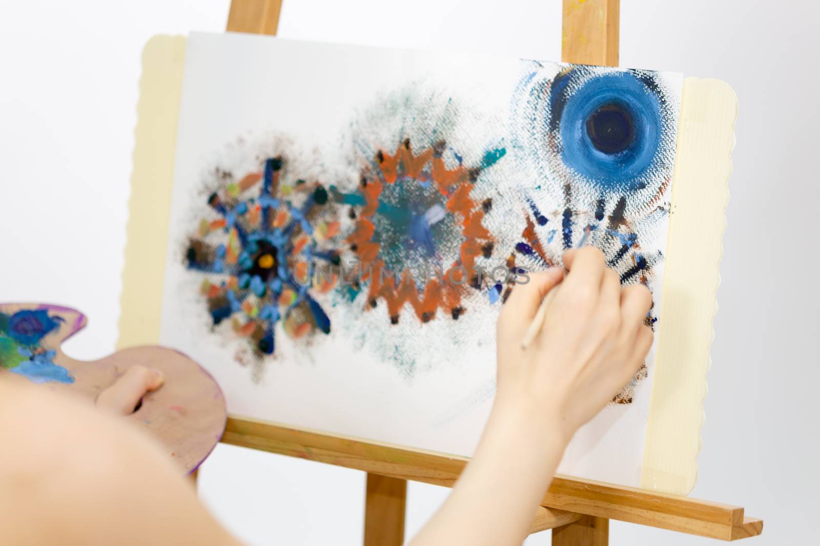 Close up of artist painting on an easel, POV shot