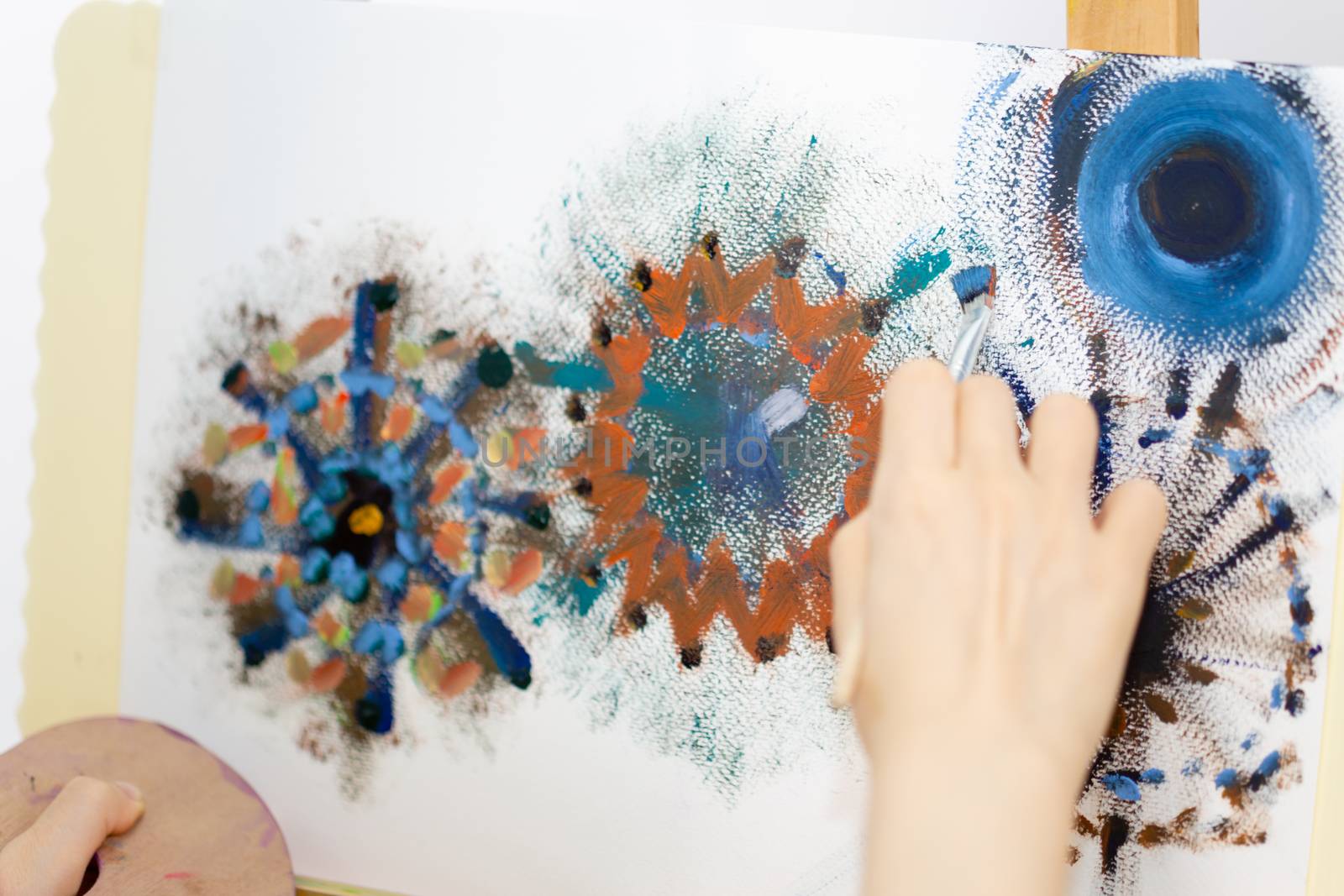 Close up of artist painting on an easel, POV shot