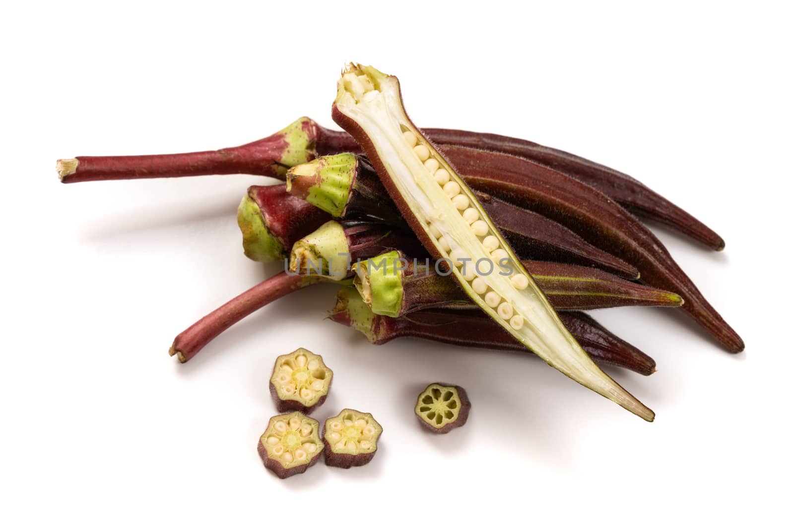 Fresh organic red okra isolated on a white background.