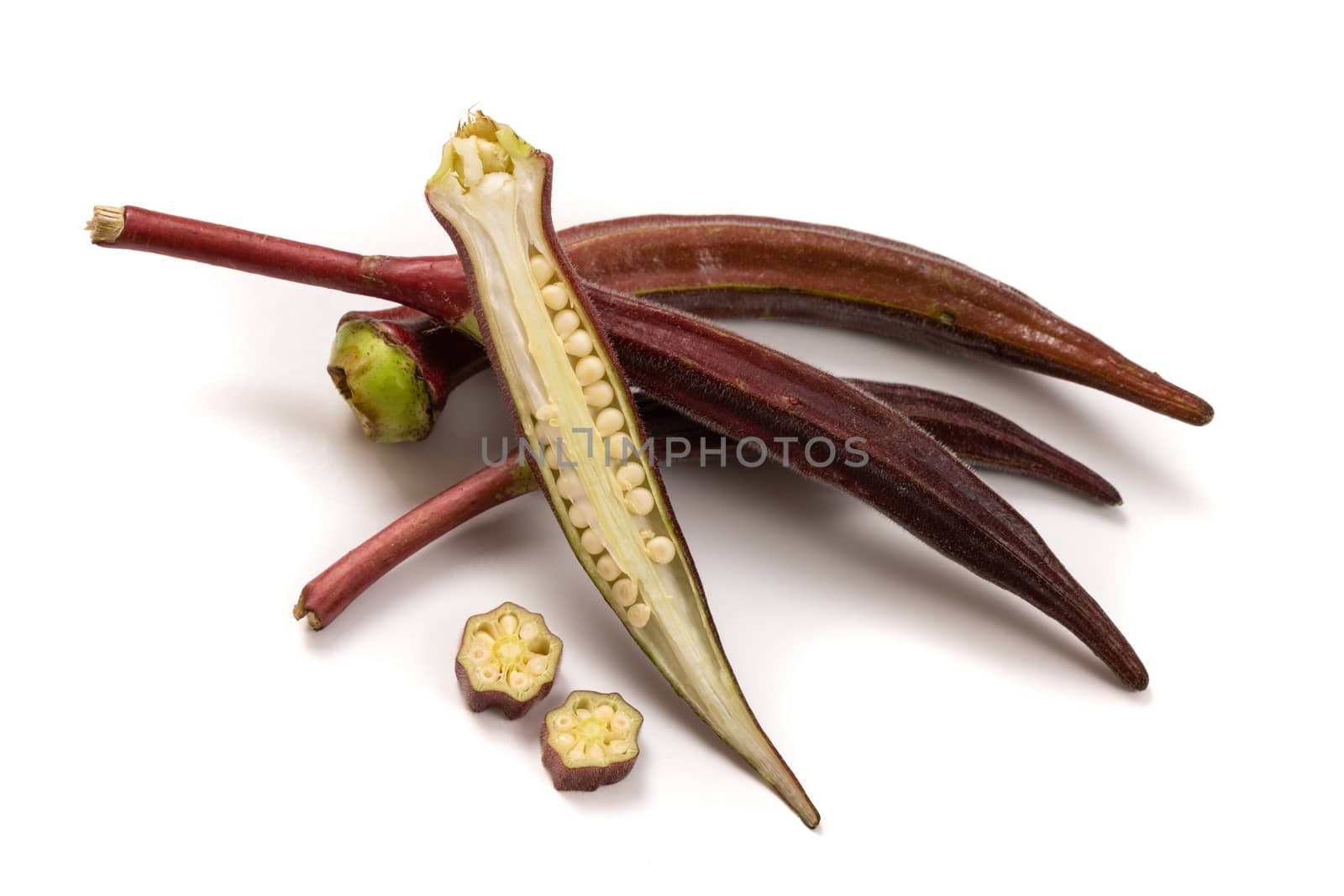 Fresh organic red okra isolated on a white background.