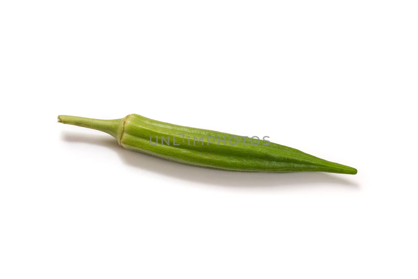 Fresh organic green okra isolated on a white background.