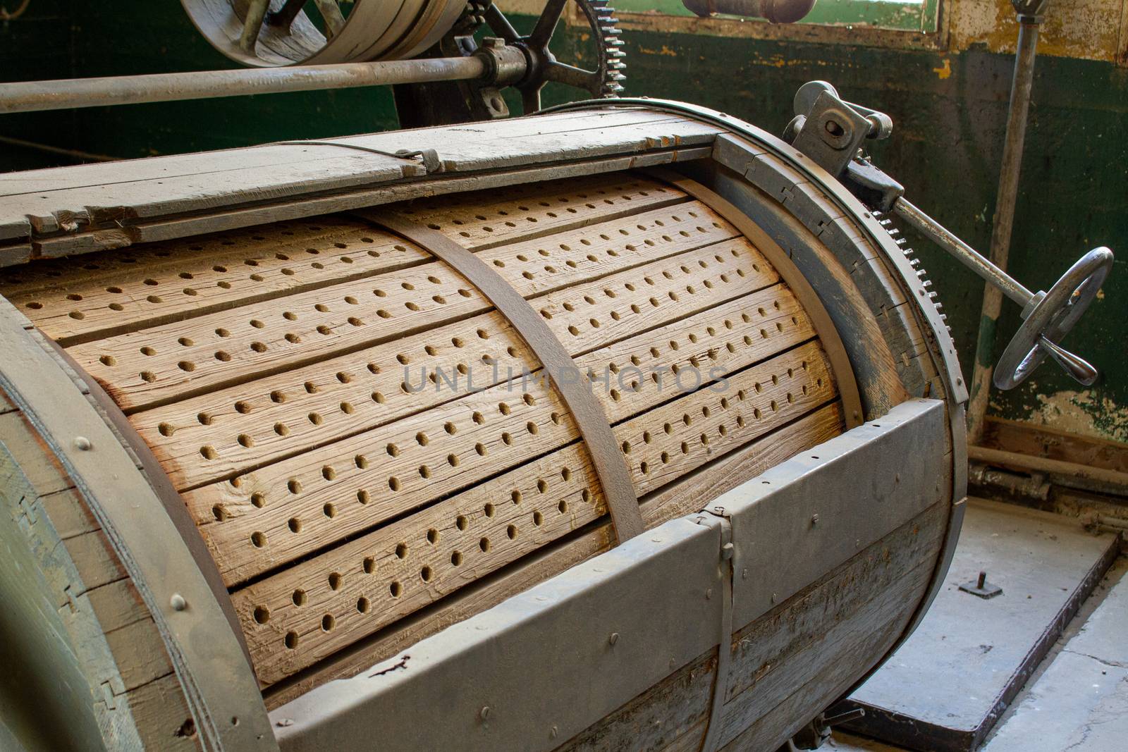 Vintage prison washing machine that is waiting for a new load of dirty clothes