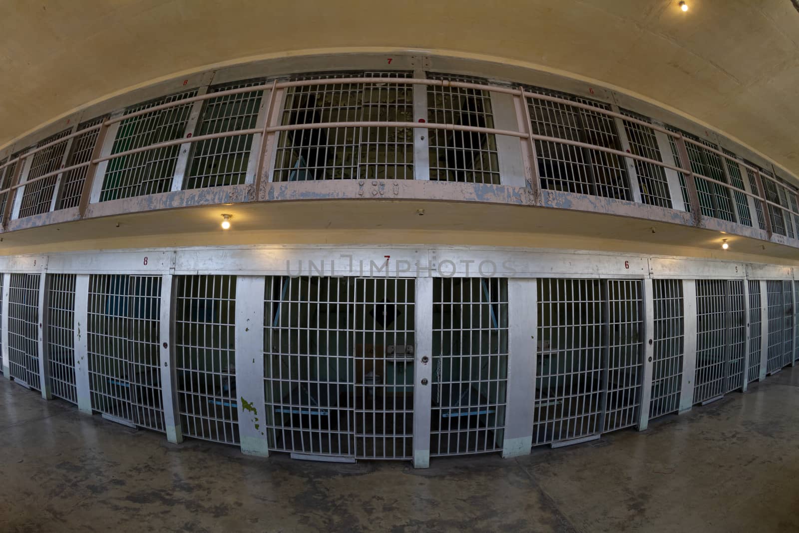 distorted view from a fisheye lens looking at the front of the prison cells