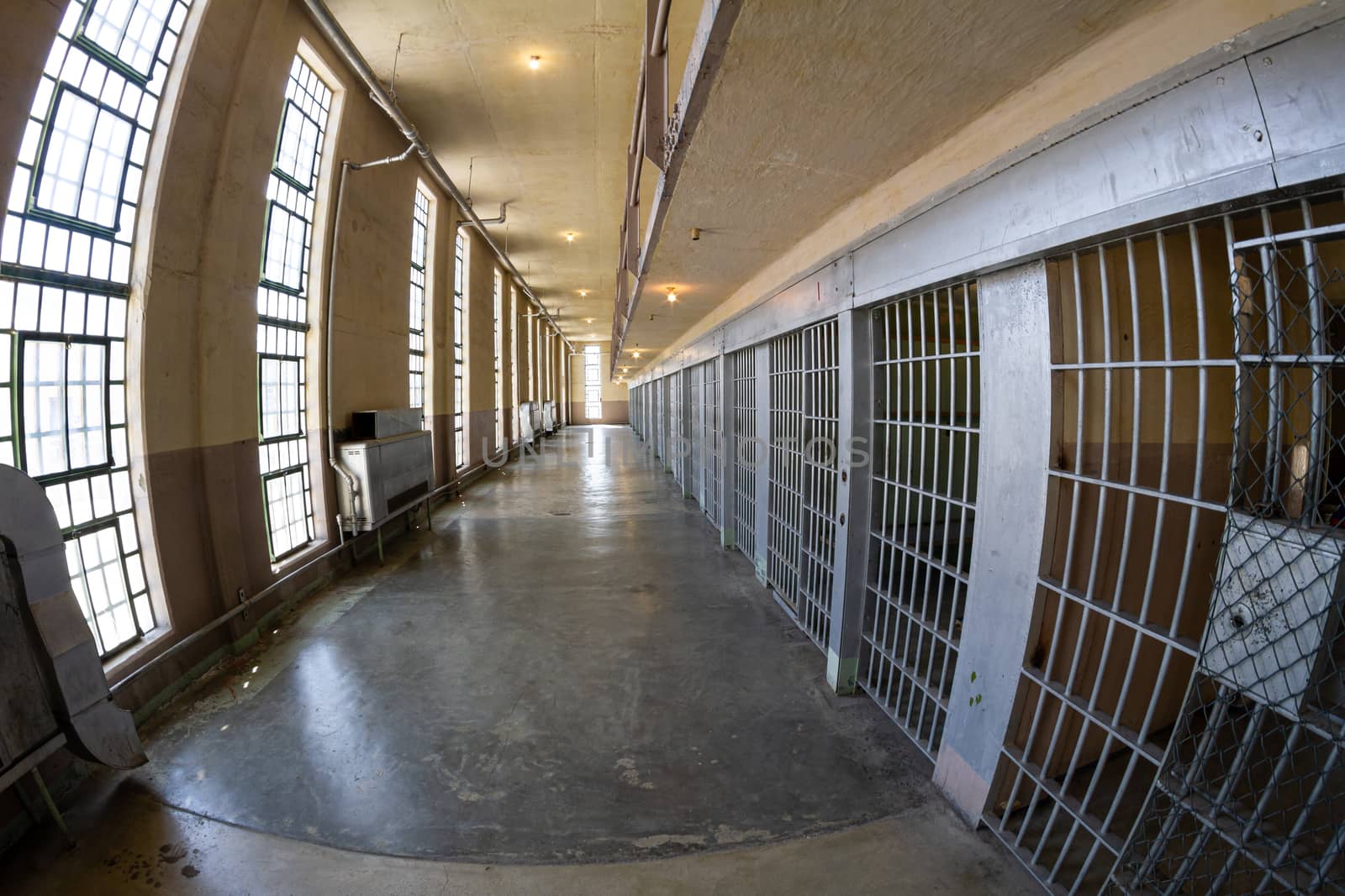 hallway of a prison with distortion from a fisheye lens