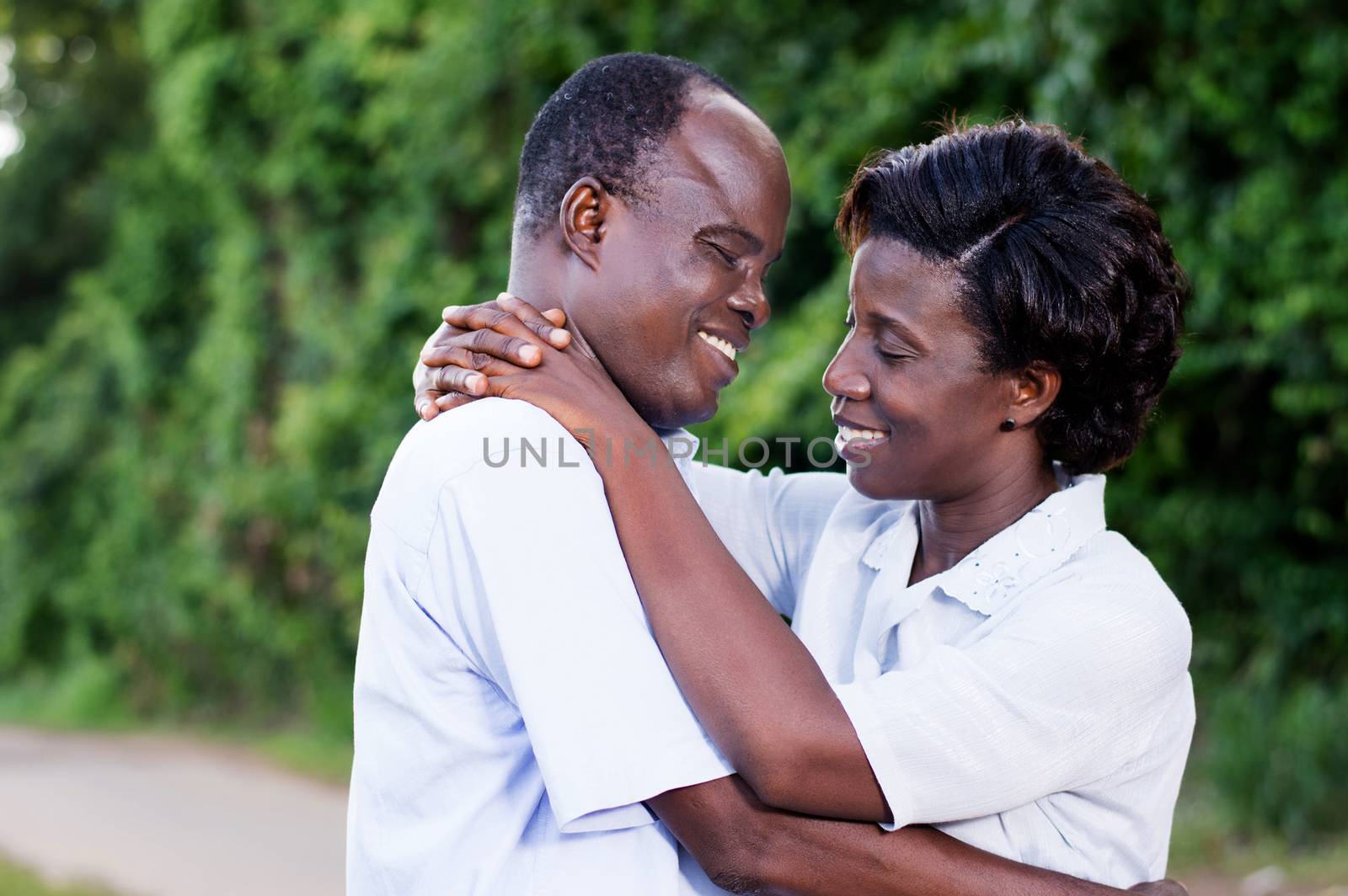 happy young couple embracing face to face in campaign