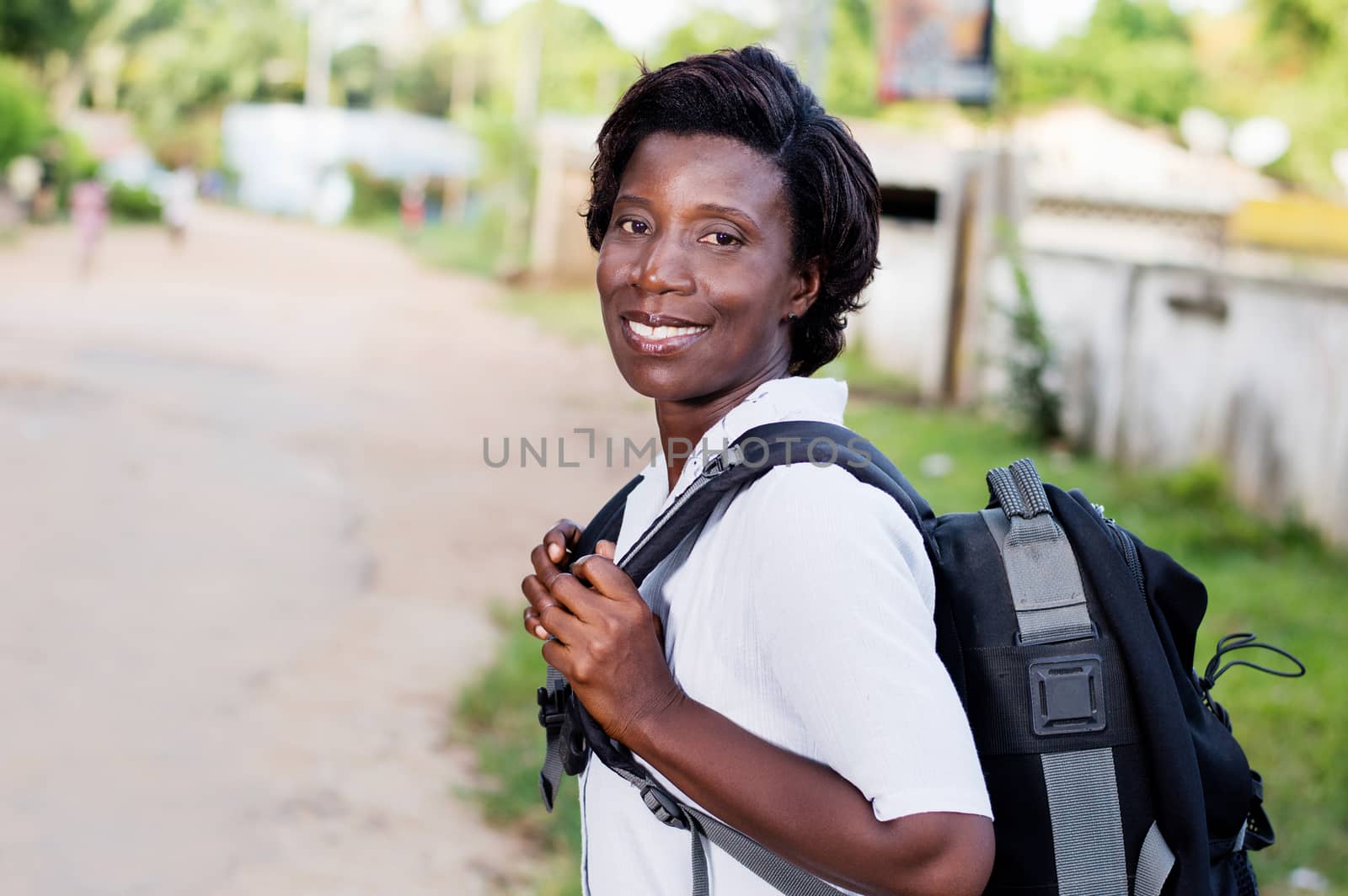 Travel, tourism - smiling young woman with backpack ready to hit the road.