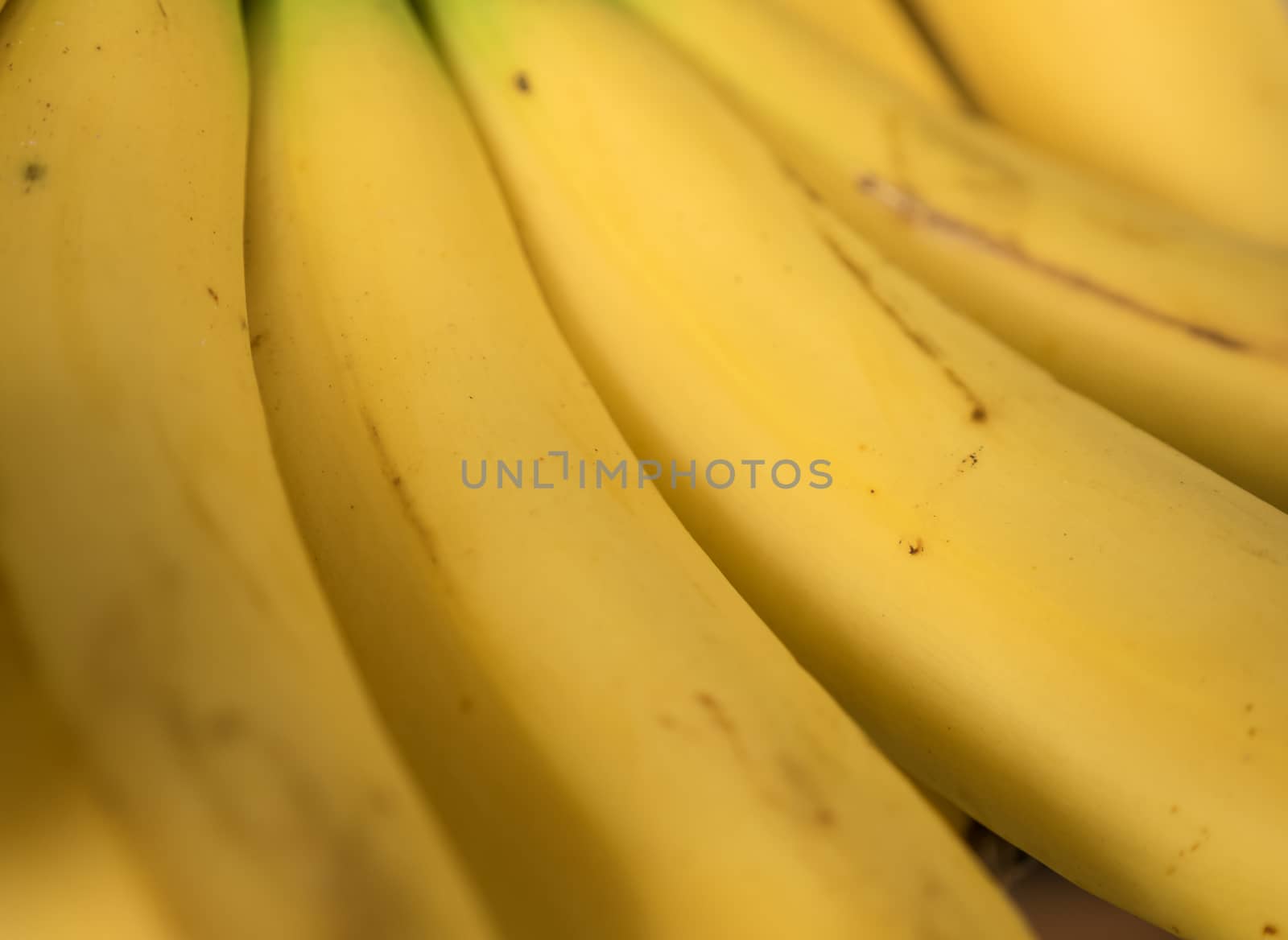 Banana in skin close up by azamshah72