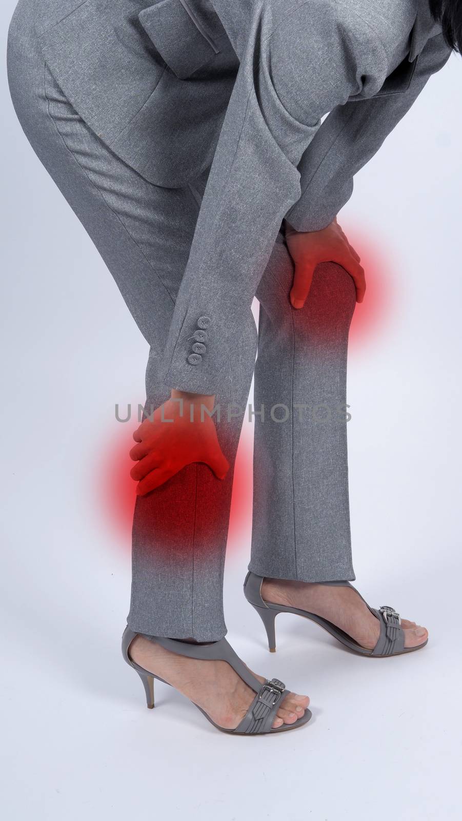 Business woman muscle suffering or painful from myositis or office syndrome or working which represent pain point by red gradient dot color and grey color suit and white background