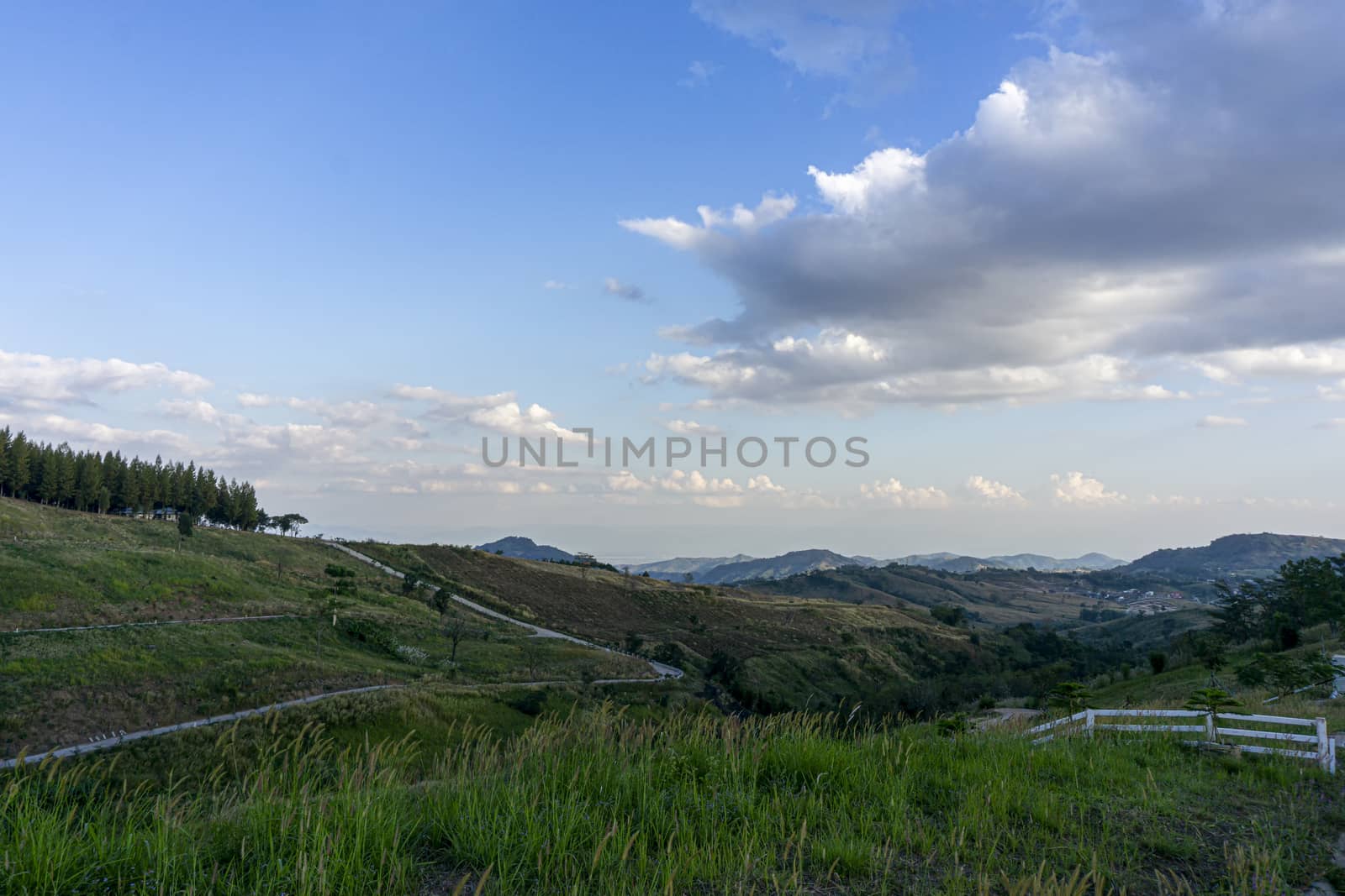 Blue sky, white clouds. Preparation area for housing on the mountain.