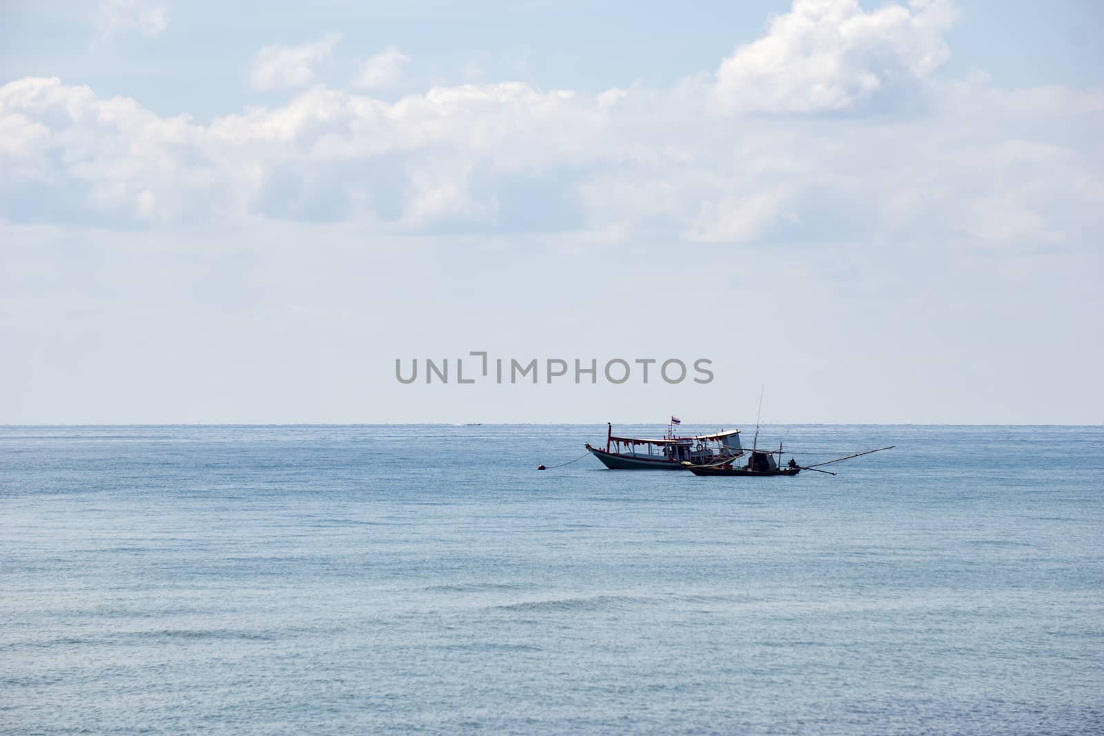 Small boats park by the sea. Small boats near the beach. Sandy beach at Sairee Beach, Chumphon Province