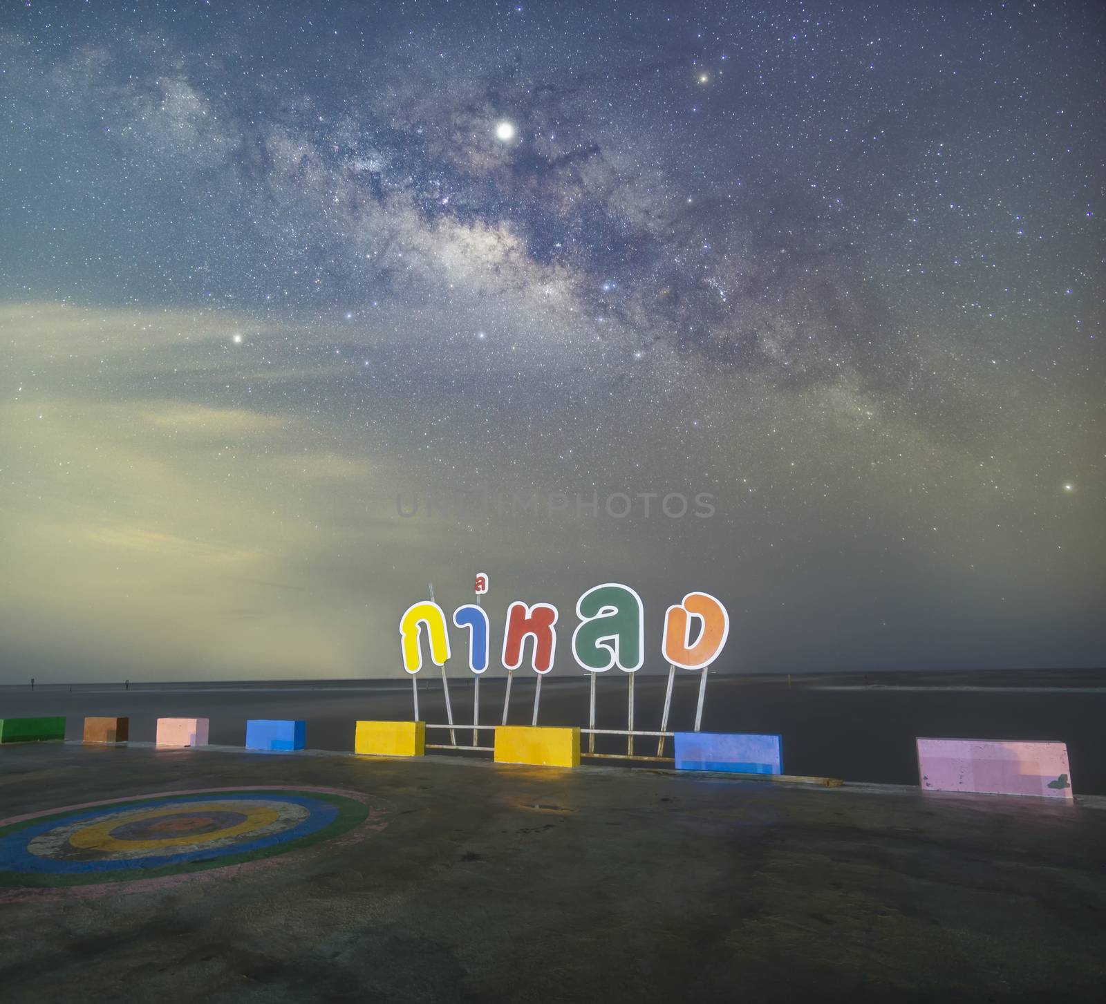 The Milky Way at the sea view point, non-English text in the image is Kalong bridge and the place name badge Here will use a variety of colors like rainbow colors.

Public places in Samut Sakhon, Thailand