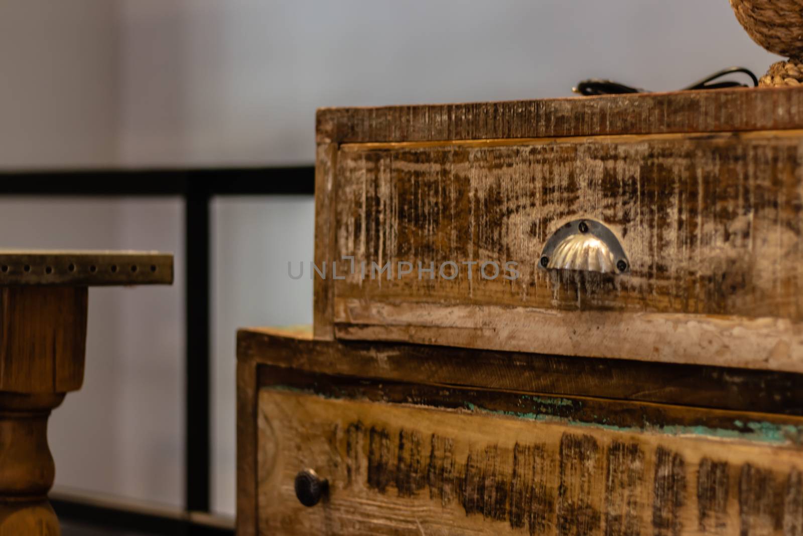 a corner from an old vintage wooden bedside table. photo has taken from a furniture shop.