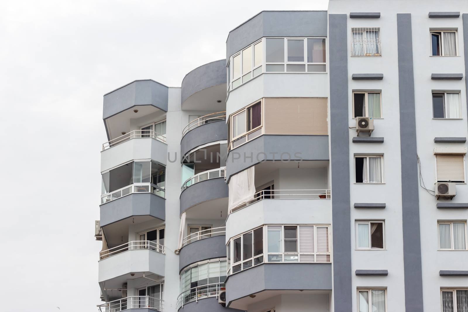 a corner shoot from an old tall building with grey and white colors. photo has taken at izmir/turkey.