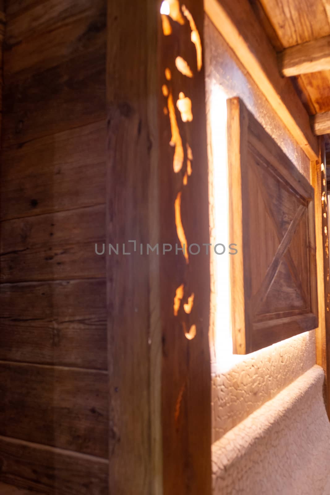 Handmade bath in the spa complex. The bath is trimmed with planks and hay.