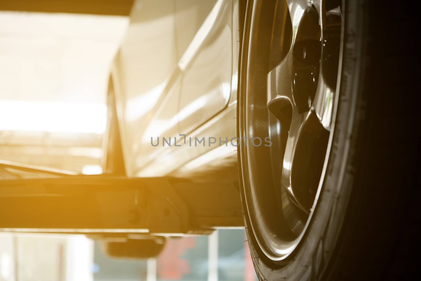 Car on lift at car service