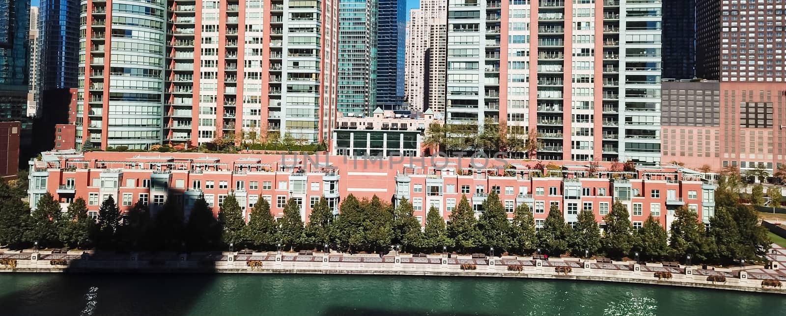 Panorama aerial view riverside skyscraper in downtown Chicago. Modern waterfront commercial and residential buildings, office spaces