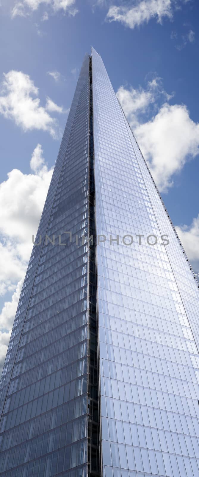 shard skyscraper looming high into the beautiful blue cloudy sky