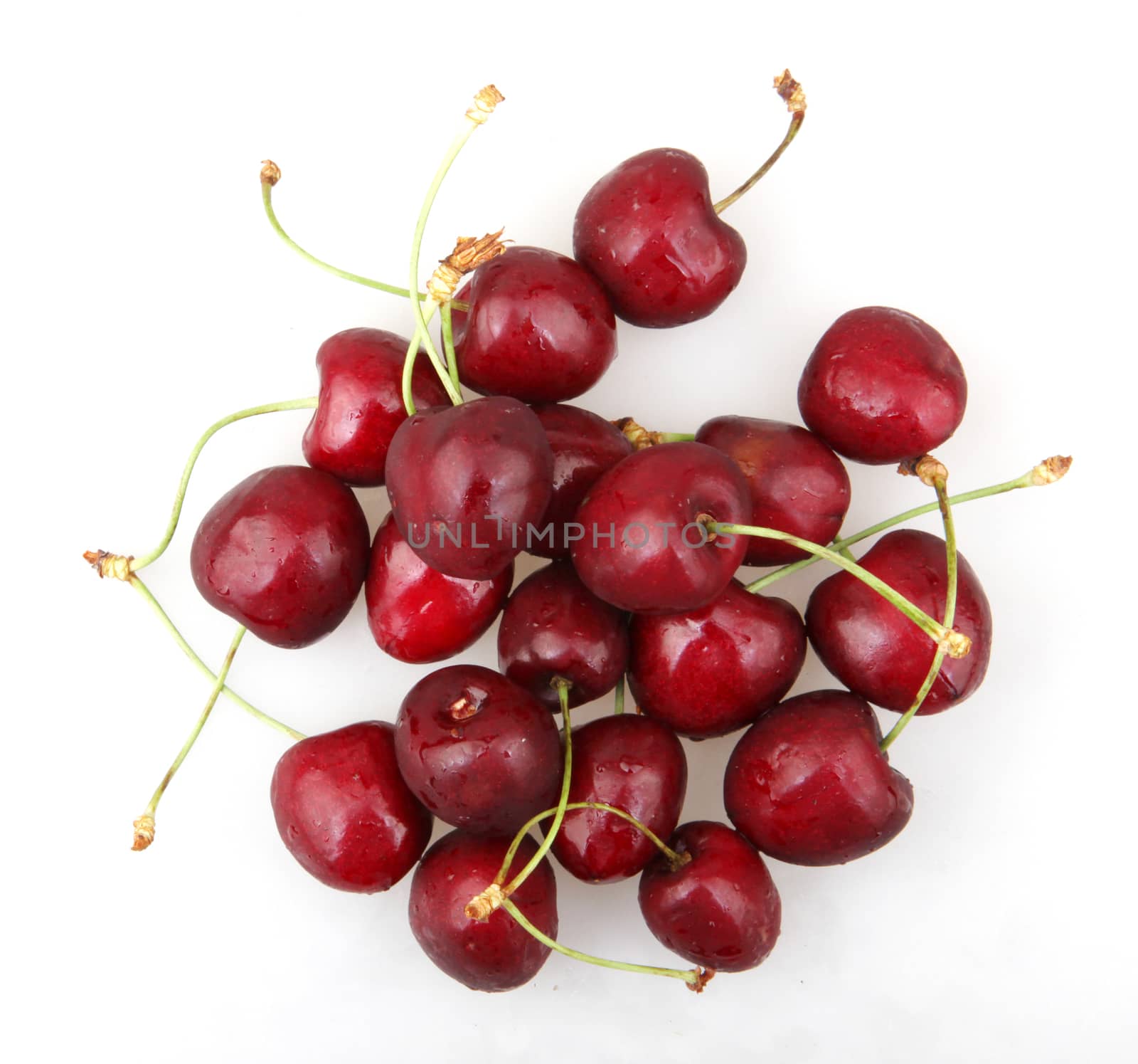 Closeup Of Ripe Cherry On White Background by nenovbrothers
