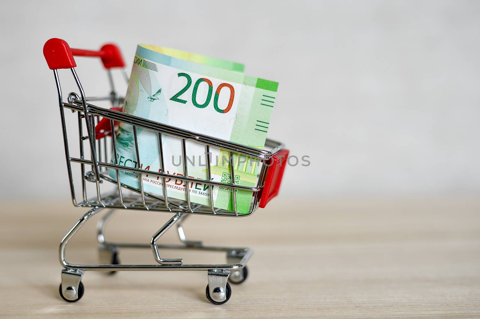 Russian money banknotes in a shopping trolley, online shopping concept