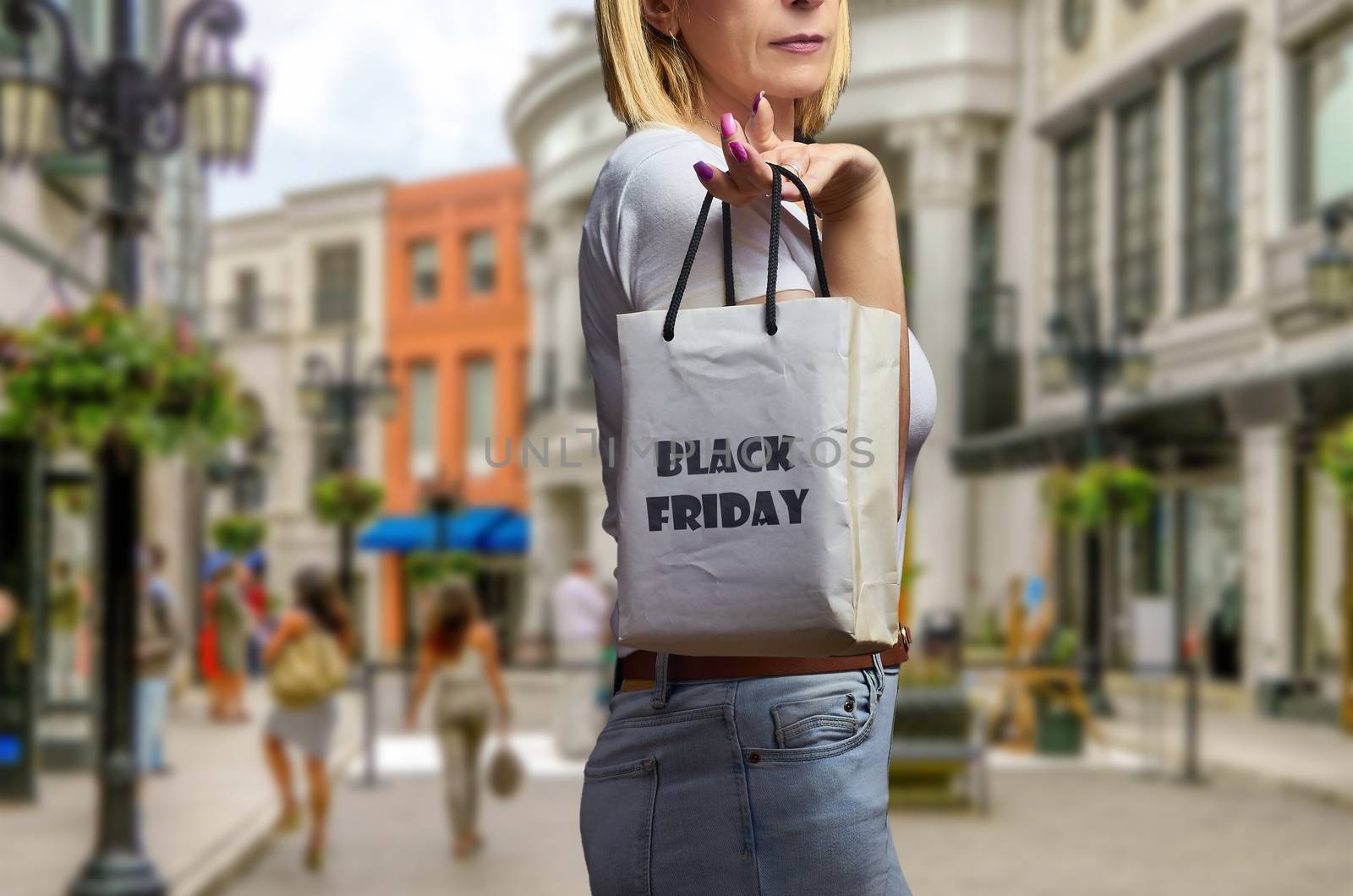 Blond woman in shopping street on black friday