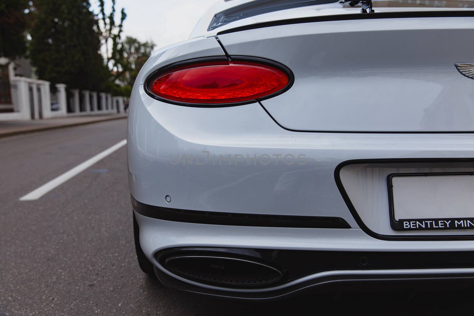 White brand new luxury sport cat Bentley Continental GT 2018 coupe on the streets of European city