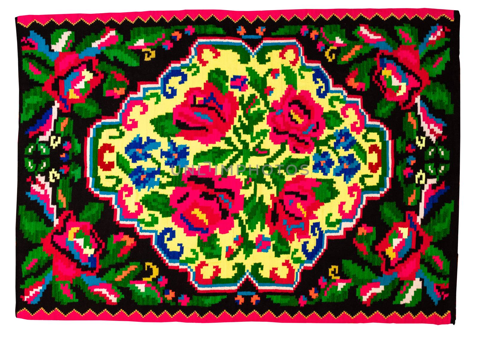 Colorful vintage handmade rug with geometrical shapes and motifs traditional of Maramures region of Romania isolated on a white background.