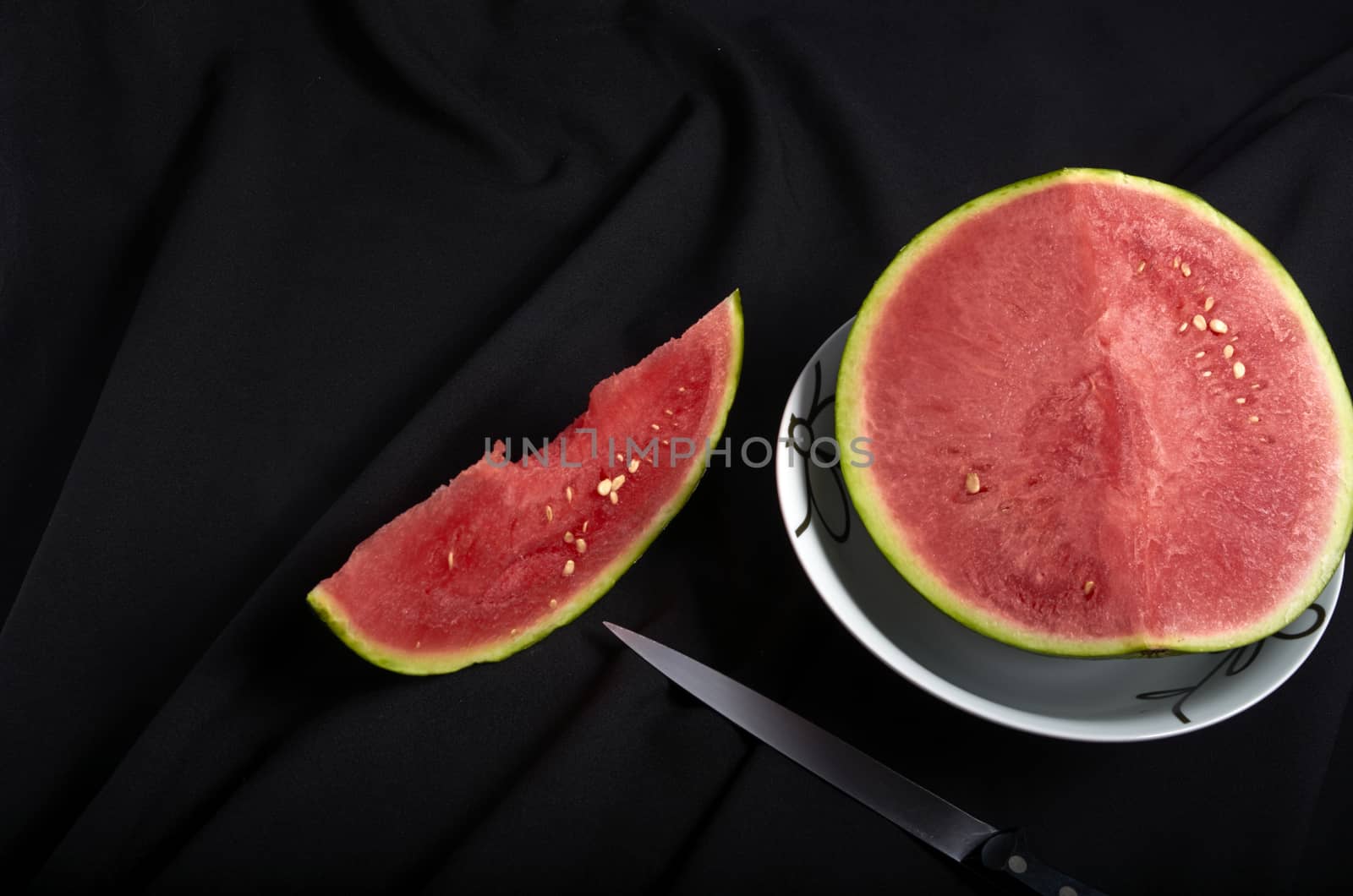 Image slice of watermelon with bite black background