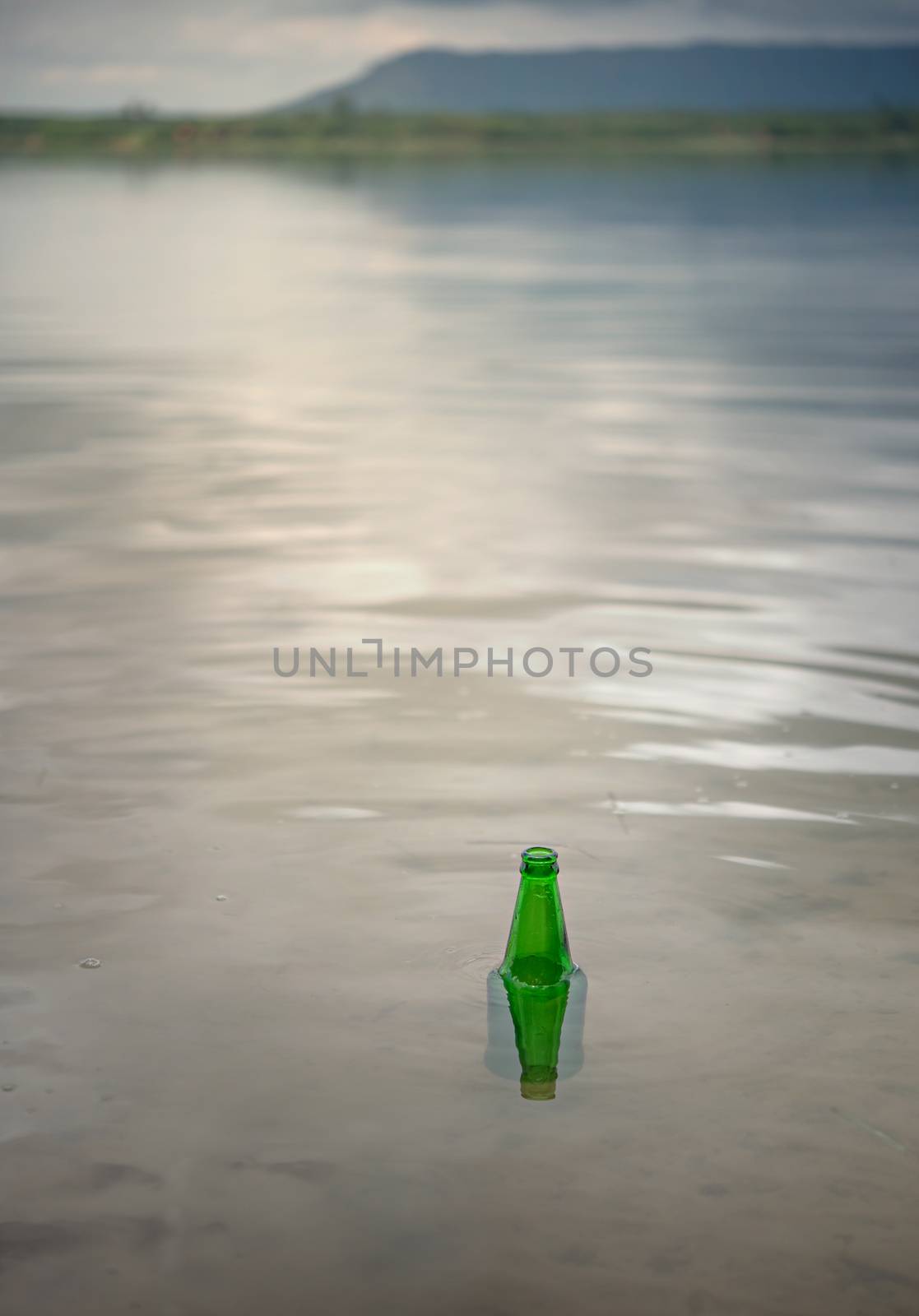 Bottle Scrap pollution in the water , environment protection concepts . Selective focus