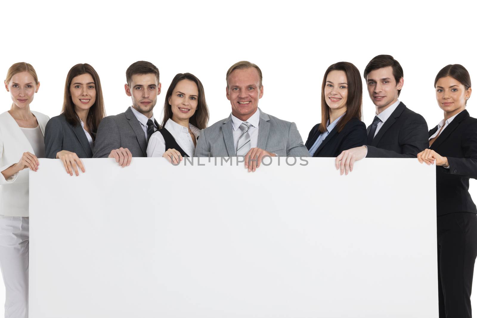 Group Of Happy Business people holding big billboard studio isolated on white background