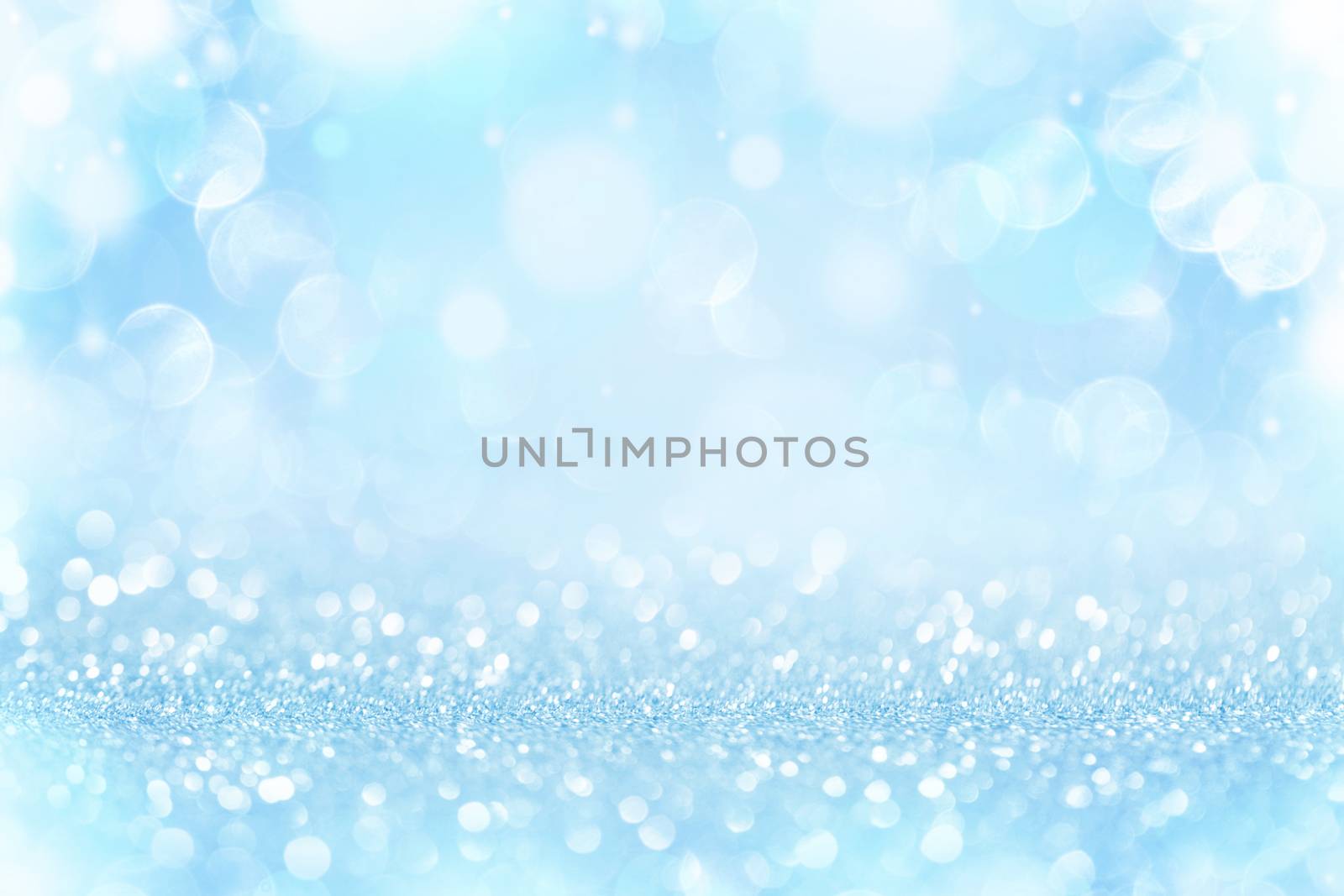 Christmas and New Year holidays blue background . Blurred glitter Bokeh