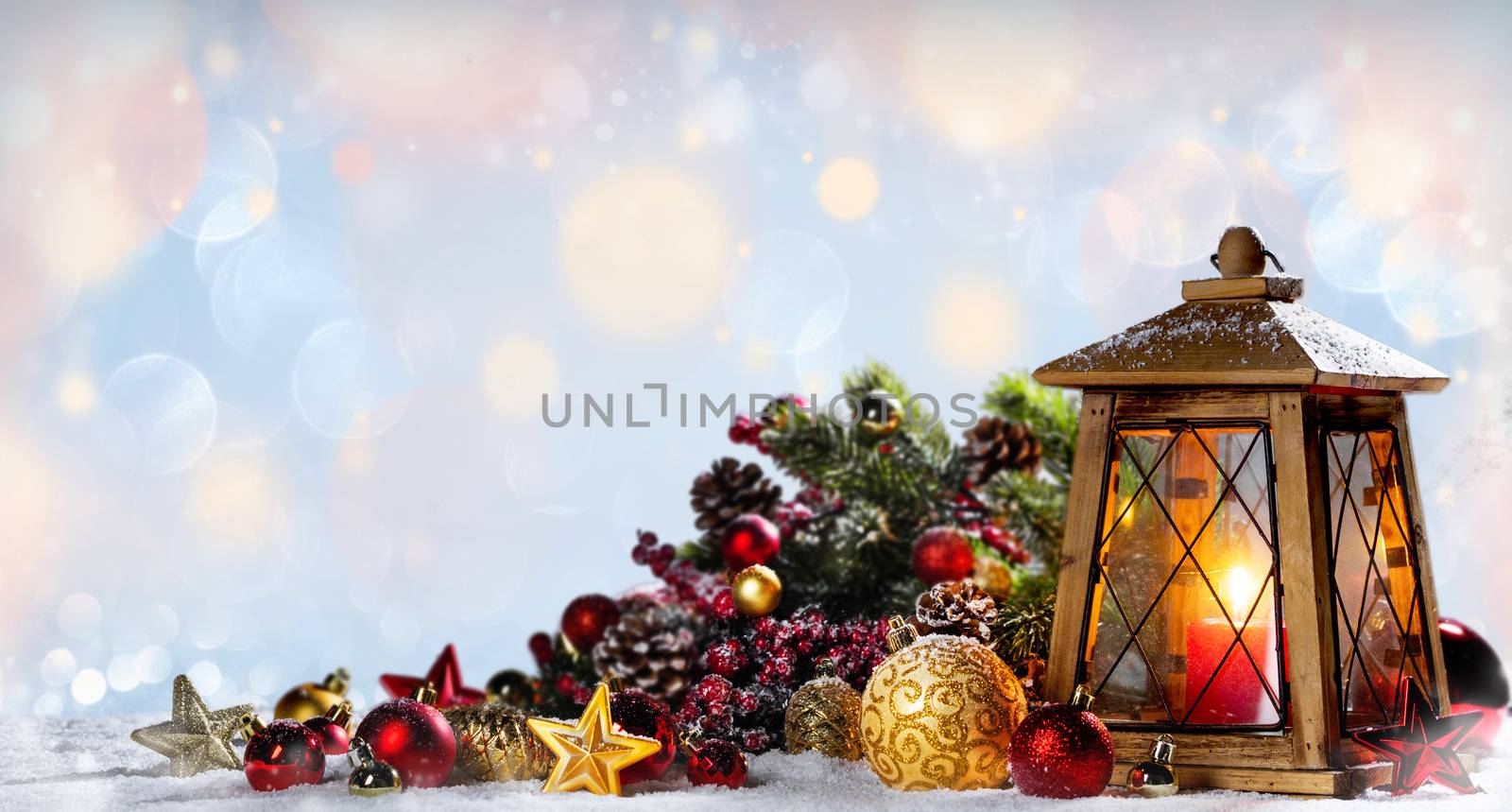 Burning candles , lantern and christmas decoration on holiday lights background