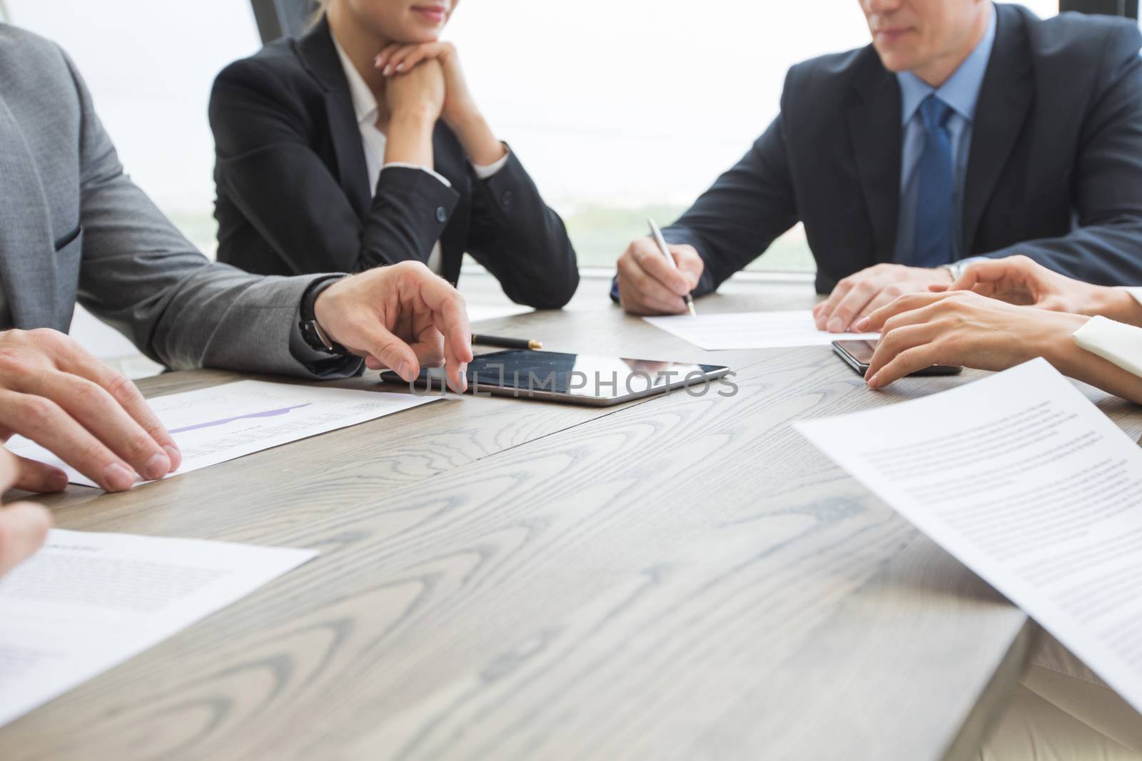 Business people work with documents at office table close up