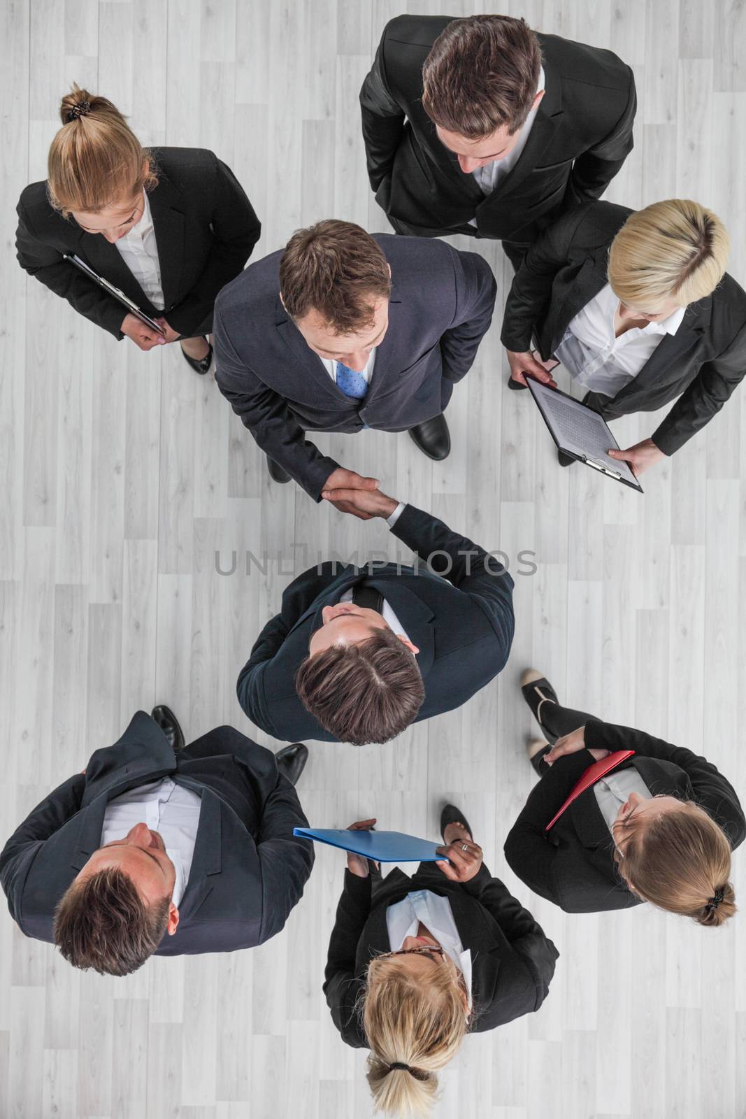 Business people shaking hand by ALotOfPeople