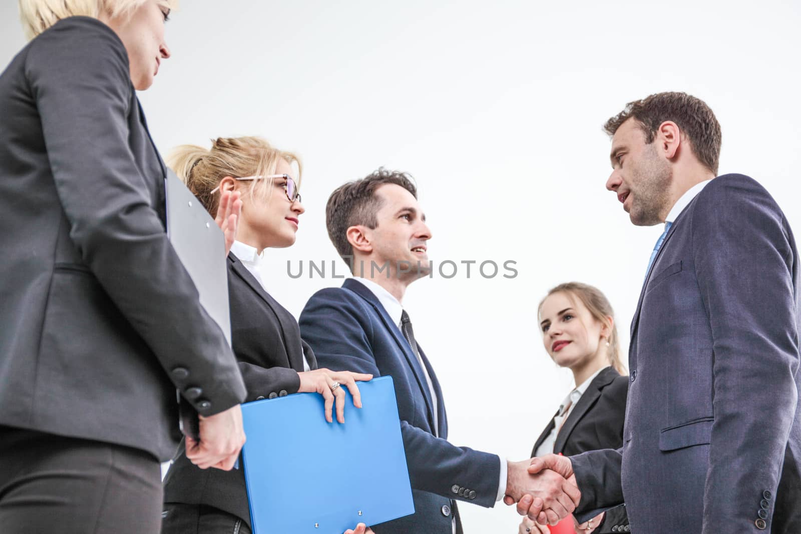 Handshake of business people team on white background