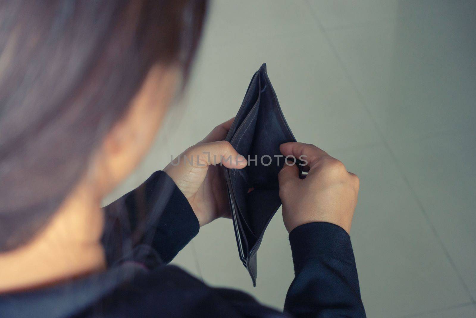 woman open wallet with no money by anankkml