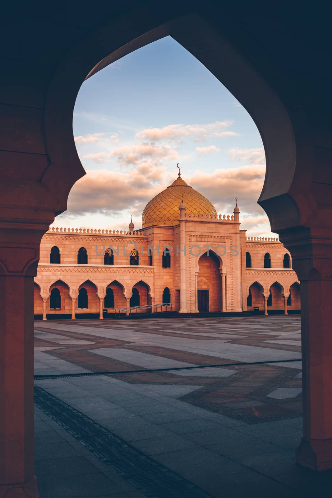 Beautiful White Mosque in the Sunset Light. View through the Arch. Bolghar, Rusiia.