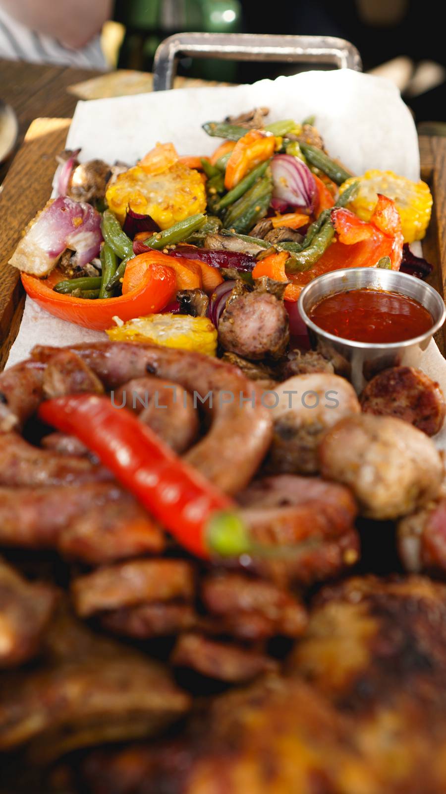 Mixed grilled meat platter. Assorted delicious grilled meat with vegetable. by natali_brill