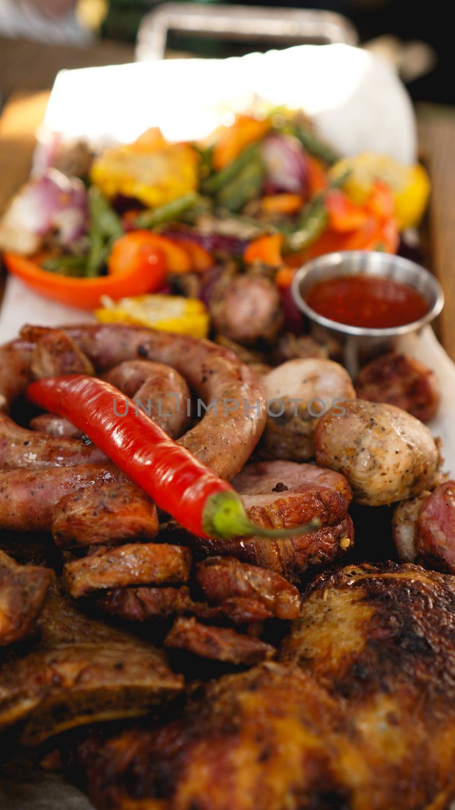 Mixed grilled meat platter. Assorted delicious grilled meat with vegetable. by natali_brill