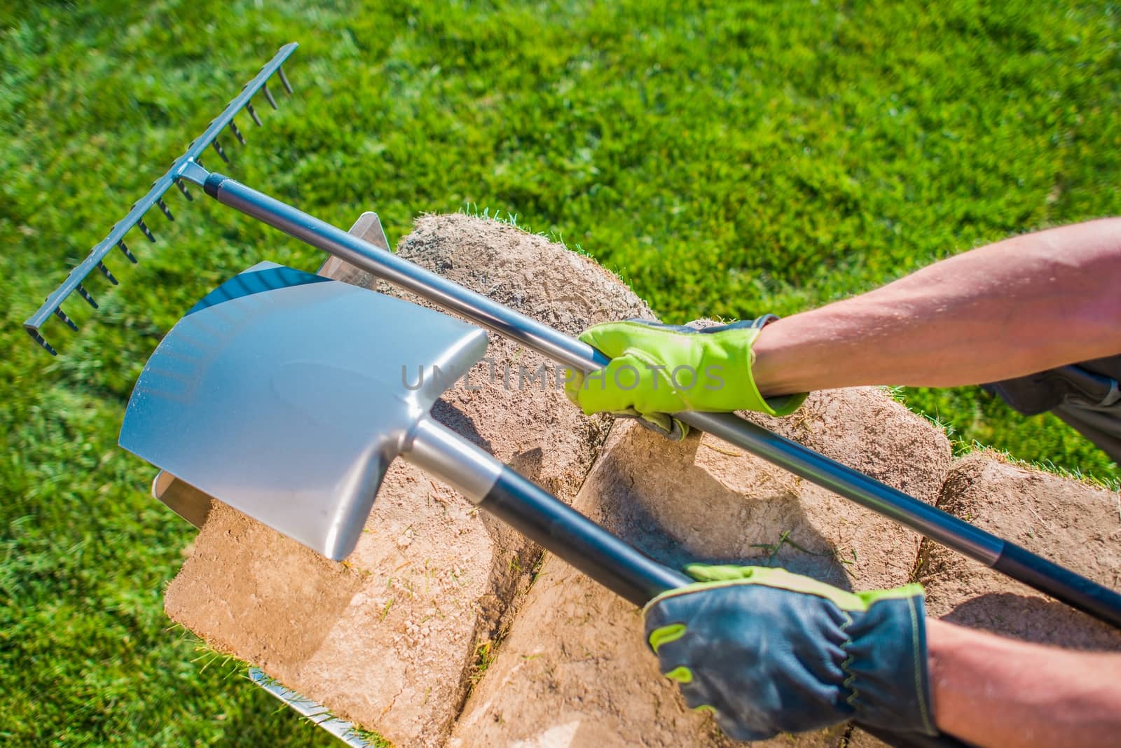 Garden Tool and the Work. Grass Turfs, Shovel and Rake on the Cart. 